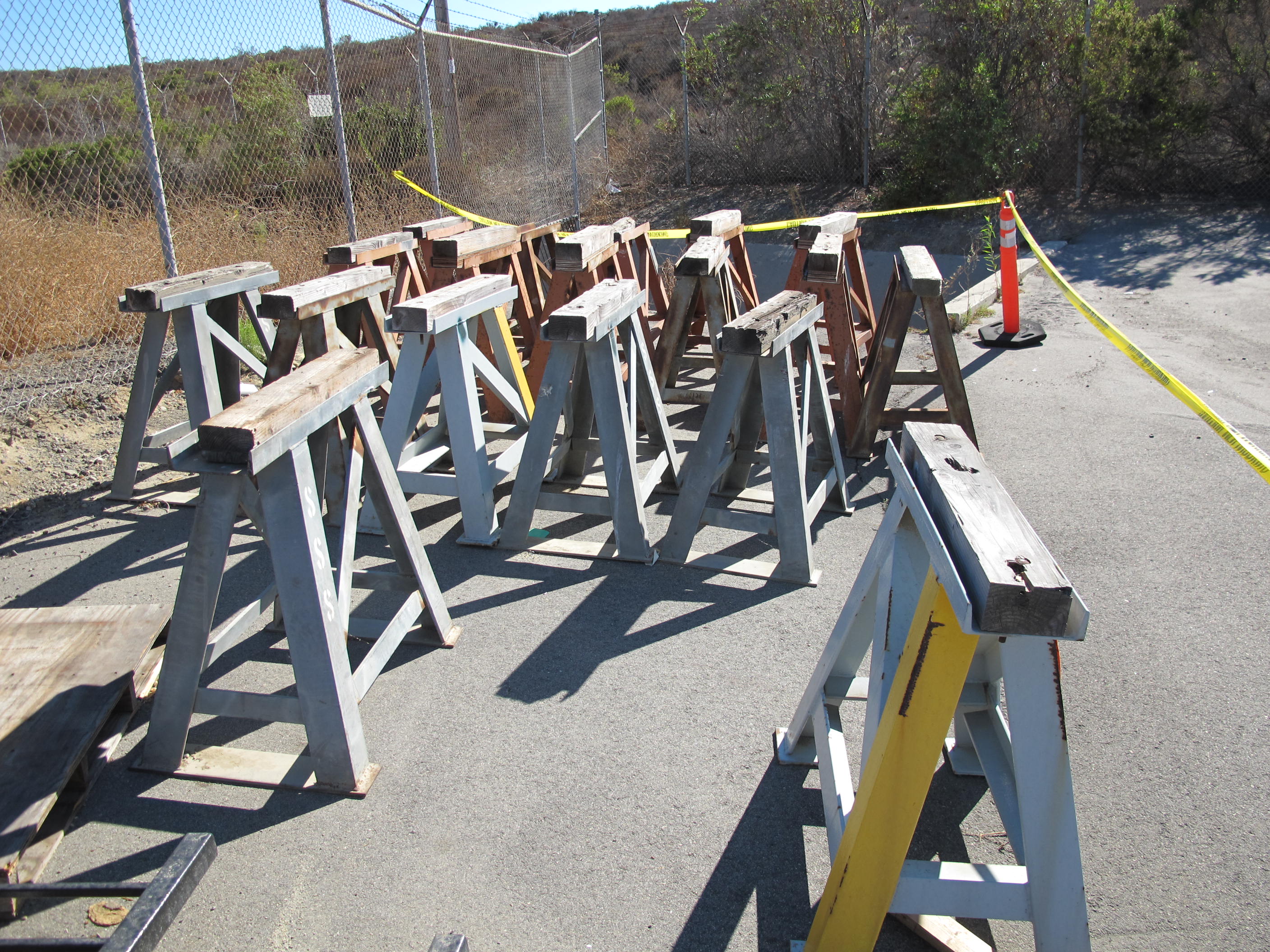 (21) HEAVY IRON SAW HORSES, (18 OUTSIDE, 3 WAREHOUSE). LOADING & HANDLING FEE $30-4599